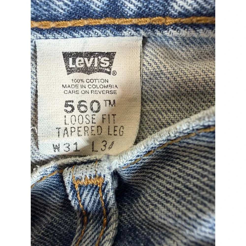 Vtg Levi's 560‎ Loose Taper Jeans W31 L34 Light Wash 90s Distressed Grunge